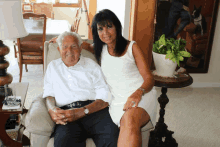 a man and a woman are posing for a picture together