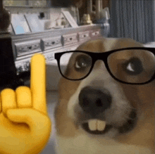 a dog wearing glasses and a yellow hand giving a horns up sign .