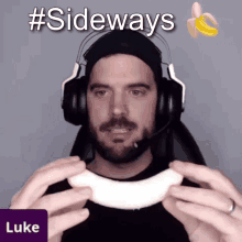 a man wearing headphones holds a banana in front of his face and says luke