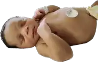 a newborn baby with a tag on his arm that says ' george '