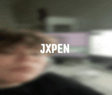 a blurry picture of a person with the name jxpen written on it