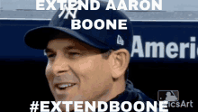 a man wearing a baseball cap that says extend aaron boone