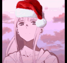 a girl wearing a santa hat is standing in front of a cloudy sky .