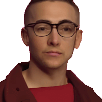 a man wearing glasses and a red shirt is looking at the camera