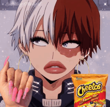 a girl with long pink nails is holding a bag of cheetos flamin hot