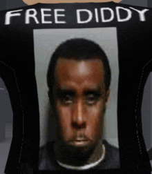 a black shirt with a picture of a man on it that says free diddy