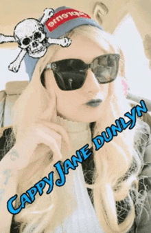 a woman wearing a skull and crossbones hat and sunglasses is named cappy jane dunlynn