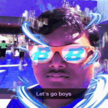 a man wearing sunglasses says let 's go boys in a snapchat