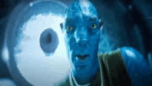 a close up of a blue man 's face with a large eye in the background .