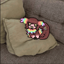 a pillow on a couch with a drawing of a dog on it