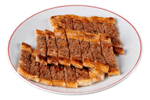 a white plate topped with a slice of meat pie .