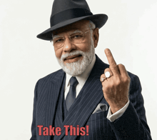 a man in a suit and hat giving the middle finger