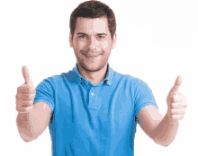 a man wearing a blue shirt is giving two thumbs up