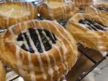 a bunch of pastries are on a cooling rack