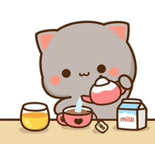 a cat is pouring tea into a cup next to a carton of milk .