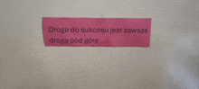 a pink piece of paper that says droga do sukcesu jest zawsze