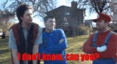 three men standing in front of a house with the words " i don 't know can you " written in red