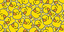 a seamless pattern of yellow rubber ducks on a white background .