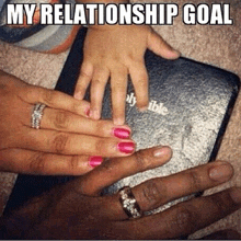 a woman with pink nail polish holds a child 's hand over a bible