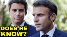 two men in suits are standing next to each other and the caption says " does he know "