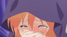 a girl with orange hair is crying and covering her face with her hands