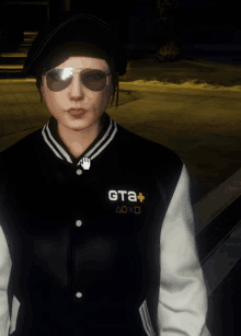 a woman wearing sunglasses and a jacket that says gta + on it