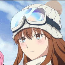 a girl wearing a hat and goggles is looking at something