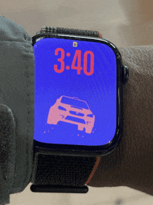 a smart watch displays the time as 3:40 on a blue background