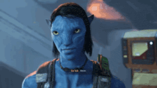 a man with a blue face is wearing a necklace that says ' so sick '