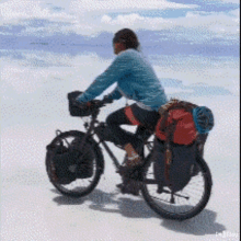 a person riding a bike on a snowy surface