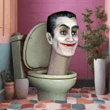 a man 's head is sticking out of a toilet bowl in a bathroom .