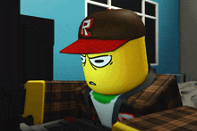 a yellow cartoon character wearing a red hat with the letter r on it