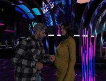 a man holds a woman 's hand in front of a sign that says ' vegas '