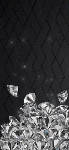 a pile of diamonds on a black background with a diamond pattern