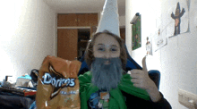 a person with a beard and a bag of doritos