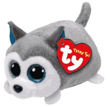 a stuffed husky with a tag that says teeny ty 's on it