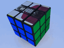 a colorful rubik 's cube with a picture of a man on it