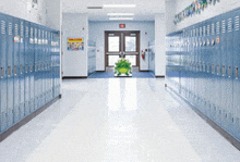 a hallway with lots of lockers and a sign that says " welcome "