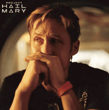 a close up of a man 's face with the words project hail mary written above him