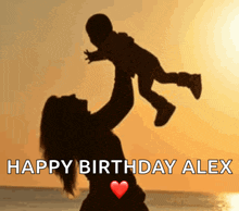 a silhouette of a woman holding a baby with the words happy birthday alex below