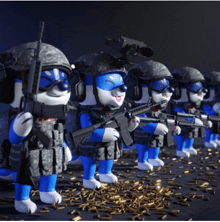 a row of toy soldiers with guns are standing next to each other