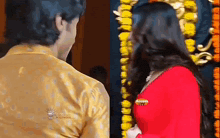 a man and a woman are standing next to each other .