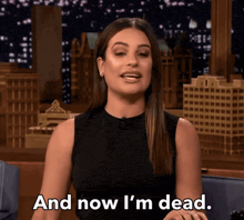 a woman says " and now i 'm dead " in front of a cityscape