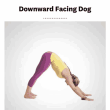 a woman in a downward facing dog pose