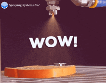 a slice of bread is being sprayed with wow