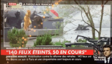 a television screen shows a news report about 140 feux eteints 50 en cours