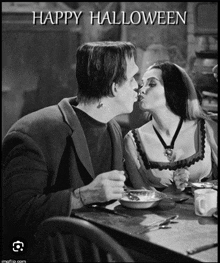 a black and white photo of frankenstein and morticia kissing with the text happy halloween