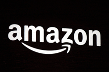 a white amazon logo with a white arrow on a black background