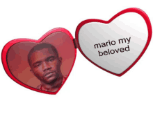 a heart shaped mirror with a picture of a man and the words " mario my beloved "