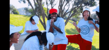 a group of people wearing white hats and shirts with a logo that says ' united nations ' on it